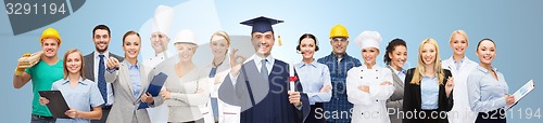 Image of happy bachelor with diploma over professionals