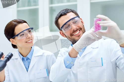 Image of young scientists making test or research in lab