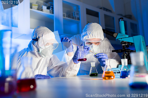 Image of close up of scientists making test in lab