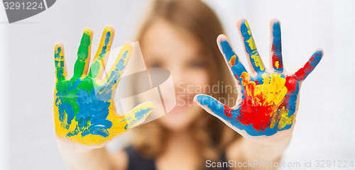 Image of girl showing painted hands