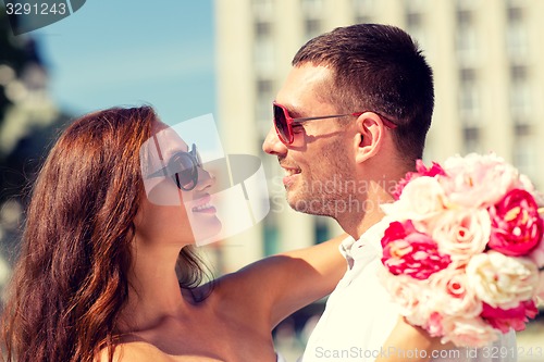 Image of smiling couple in city