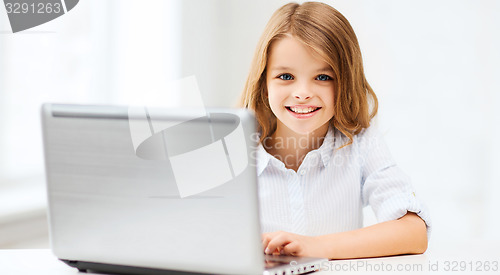 Image of girl with laptop pc at school