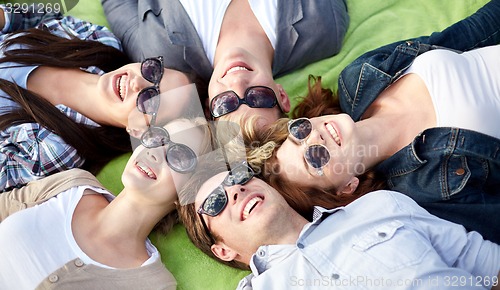 Image of group of students or teenagers lying in circle