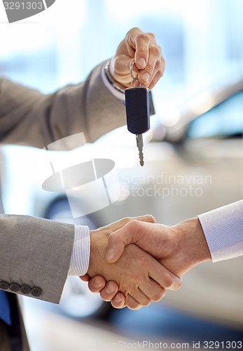 Image of close up of handshake in auto show or salon