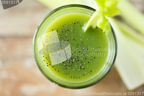 Image of close up of fresh green juice glass and celery