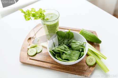 Image of close up of fresh green juice glass and celery