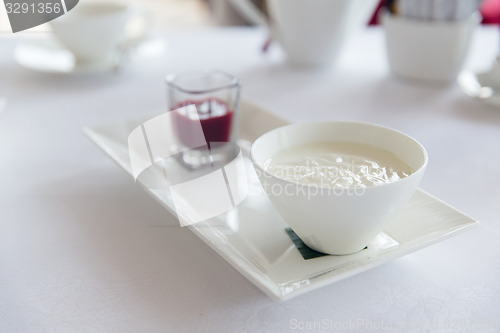 Image of close up of yogurt and jam at restaurant