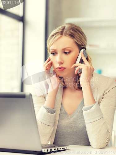 Image of businesswoman with cell phone