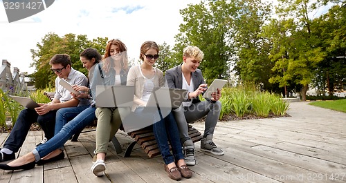 Image of students or teenagers with laptop computers