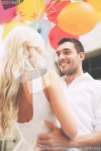 Image of couple with colorful balloons