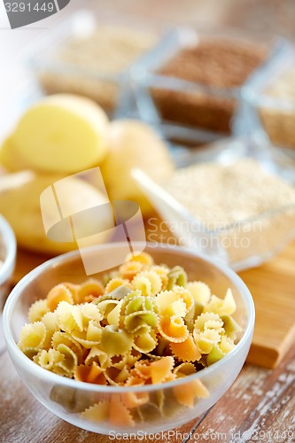 Image of close up of pasta in glass bowls on table