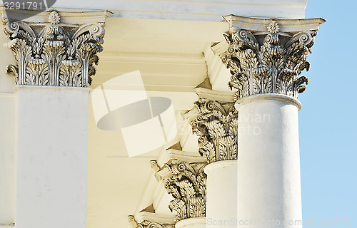 Image of architecture, classical columns against blue sky