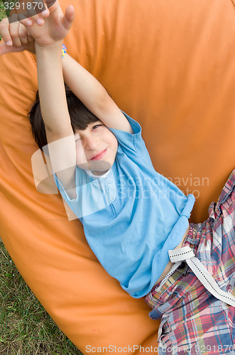 Image of boy stretching arms