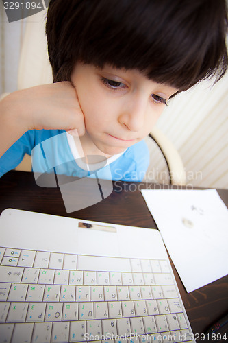 Image of boy with computer