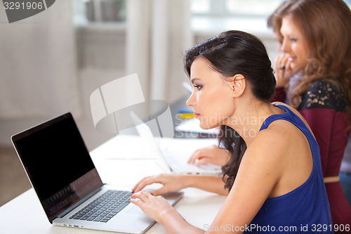 Image of students using laptop