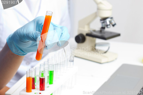 Image of Hand holding test tube