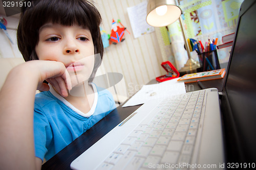 Image of distance learning, preschool child with computer