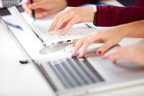 Image of Hands of an student typing