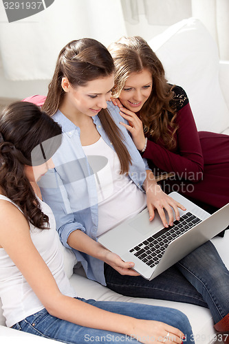 Image of three girls and a laptop