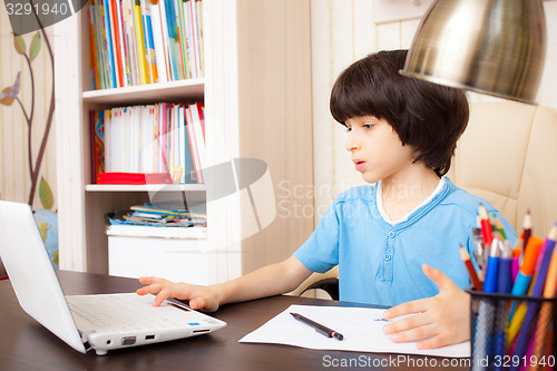 Image of schoolboy doing homework