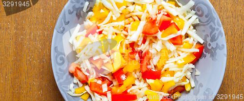 Image of salad with fresh vegetables in plate