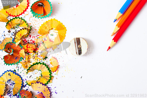 Image of varicolored pencil, shavings and sharpener