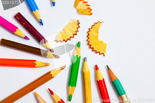 Image of set of a vintage colored pencils with shavings