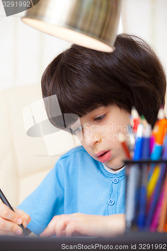 Image of Boy doing homework, portrait