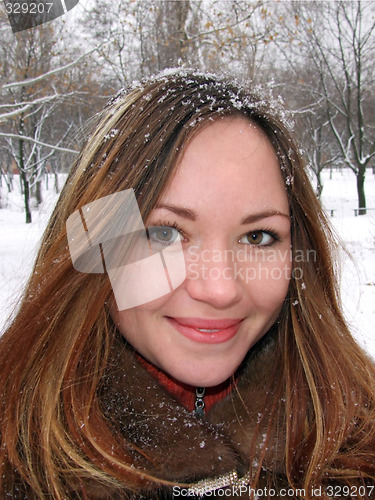Image of Portrait of the beautiful girl in the winter in park