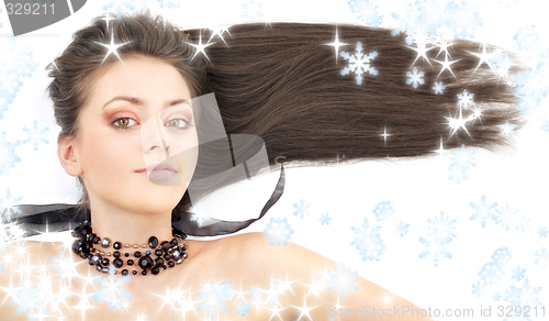 Image of lovely brunette in black collar with snowflakes