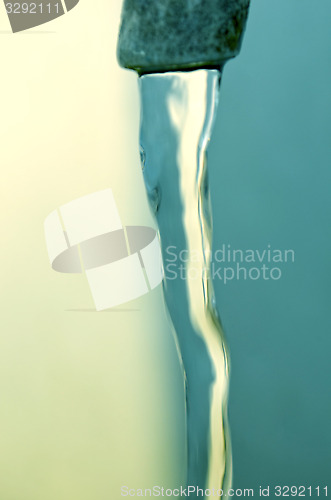 Image of Tap of running water isolated on grey background