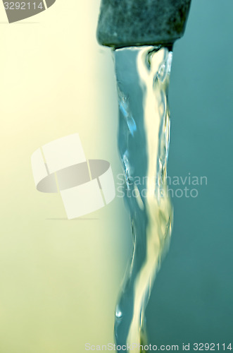 Image of Tap of running water isolated on grey background