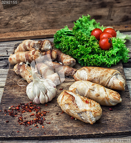 Image of set fried meat sausages on wooden background