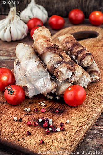 Image of set fried meat sausages on wooden background