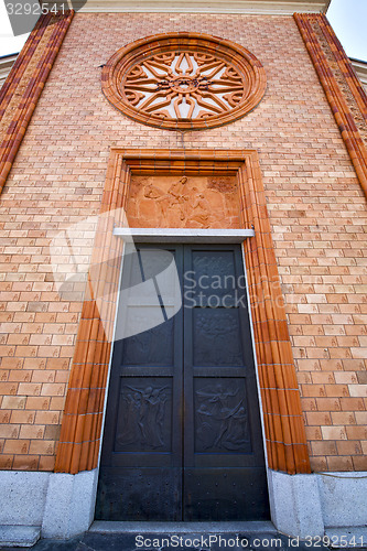Image of  church  in  the vergiate old   closed brick tower  