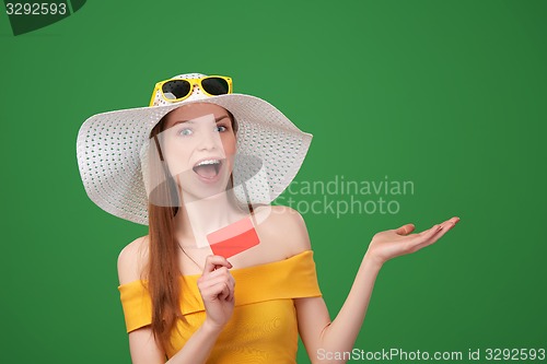 Image of Summer girl ing blank credit card