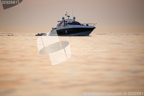 Image of Boat with dinghy