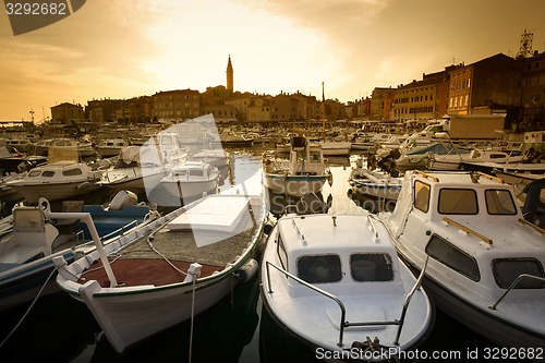 Image of Boats in marina of Rovinj at sunset