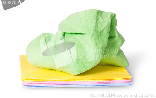 Image of Multicolored stack cleaning cloths crumpled on top