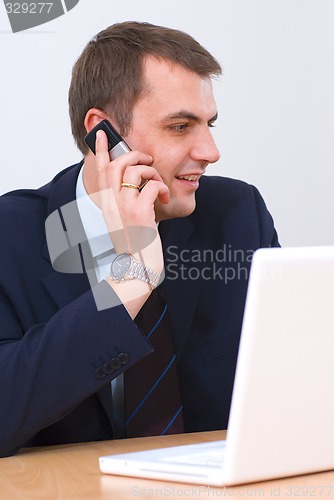 Image of Businessman talking on the phone