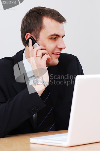 Image of Businessman talking on the phone