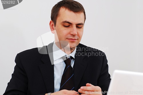 Image of Successful businessman answering the phone