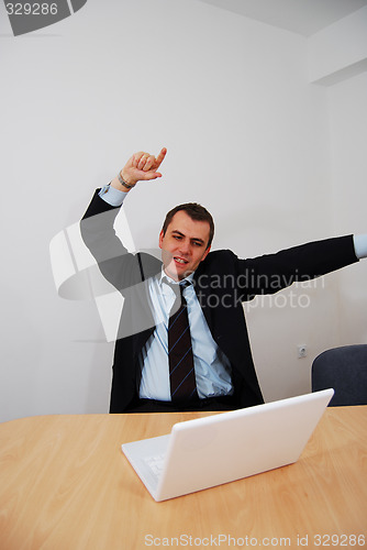 Image of Successful businessman cheering