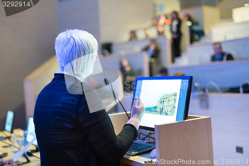 Image of Business woman lecturing at Conference.