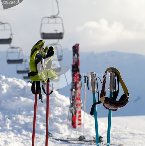 Image of Protective sports equipments on ski poles at ski resort