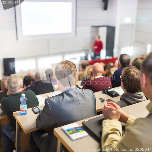 Image of Speaker at Business Conference and Presentation.