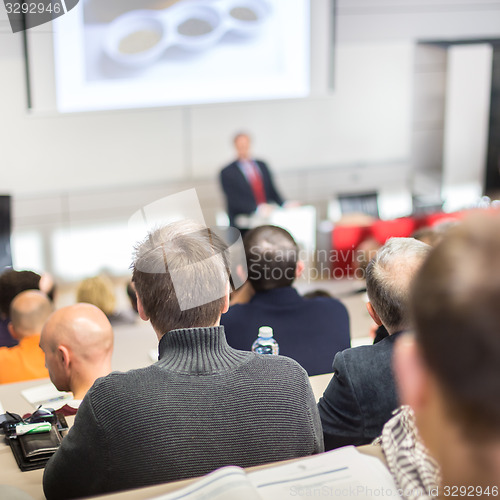 Image of Speaker at Business Conference and Presentation.