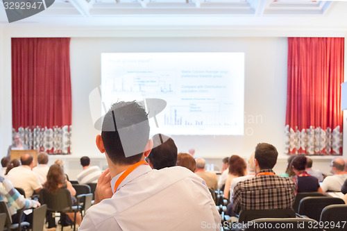 Image of Speaker at Business Conference and Presentation.