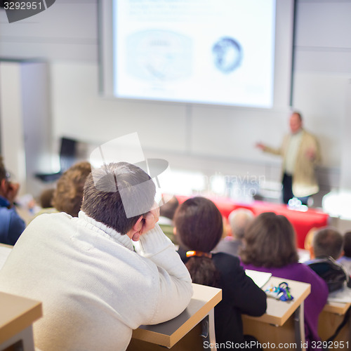 Image of Speaker at Business Conference and Presentation.