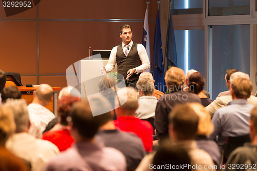 Image of Speaker at Business Conference and Presentation.